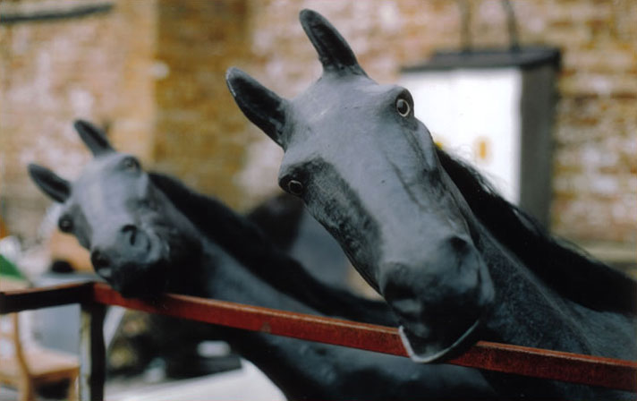 Horses in the Stables Market junkyard in Camden, London, UK